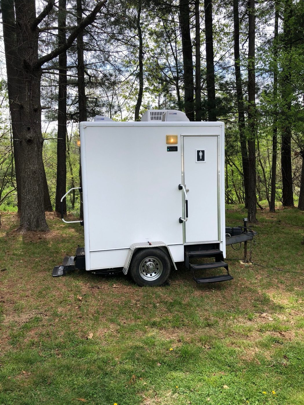 Clean Spot luxury restroom trailer set up on a lawn