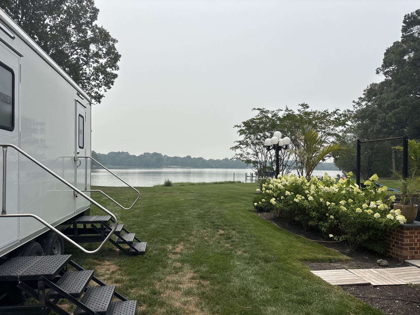 Luxury restroom trailer on a waterfront lawn at a private Eastern Shore estate